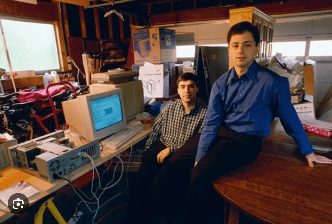 Larry Page and Sergey Brin beside an early Google workstation